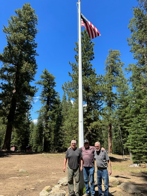 Robbie, Rich, and Richard, three members of their Boy Scout troop, after raising the flag for the reunion at Camp Cottonwood. The flag was from Robbie’s father’s funeral. 